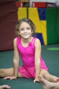 A young girl participating in a gymnastics class at Columbus Gym in New York.